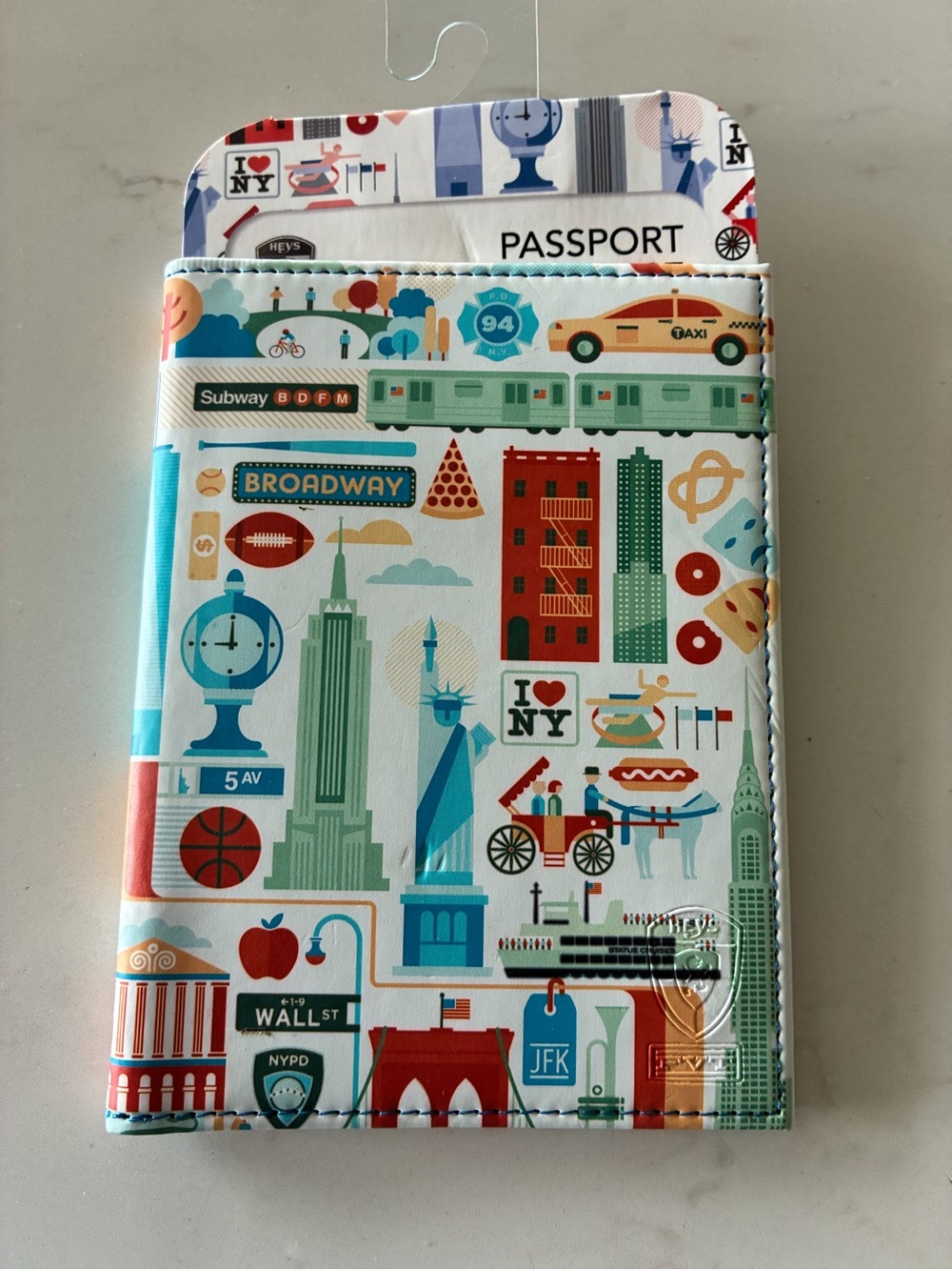 Heys FVT Cities - New York Passport Holder featuring a vibrant illustration NYC
